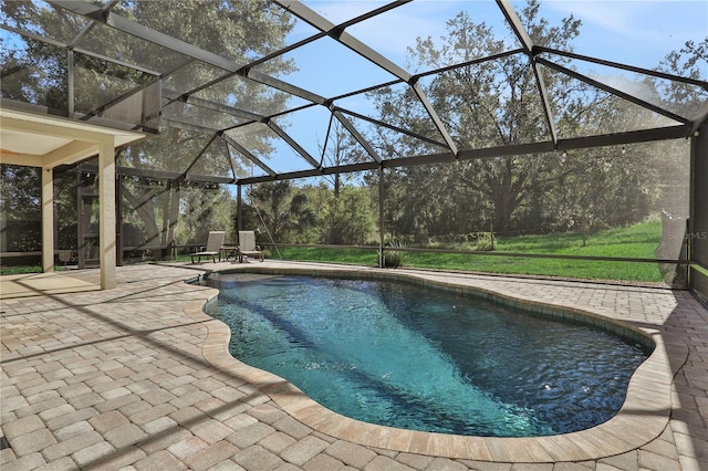 view of pool with a lanai and a patio area