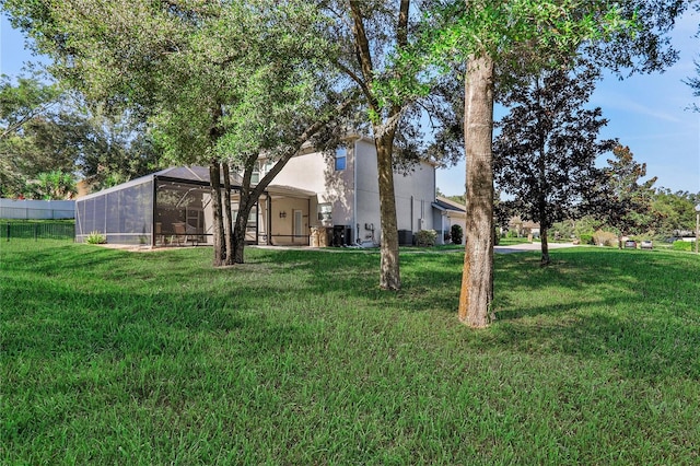 view of yard with a lanai