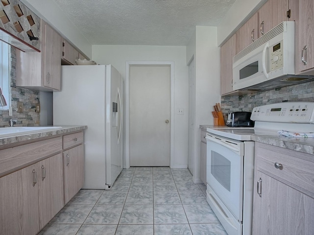 kitchen featuring light brown cabinets, sink, white appliances, a textured ceiling, and decorative backsplash