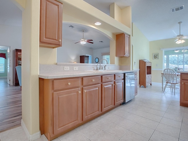 kitchen with ceiling fan, dishwasher, sink, and light tile patterned flooring