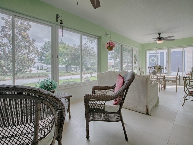 sunroom / solarium with ceiling fan