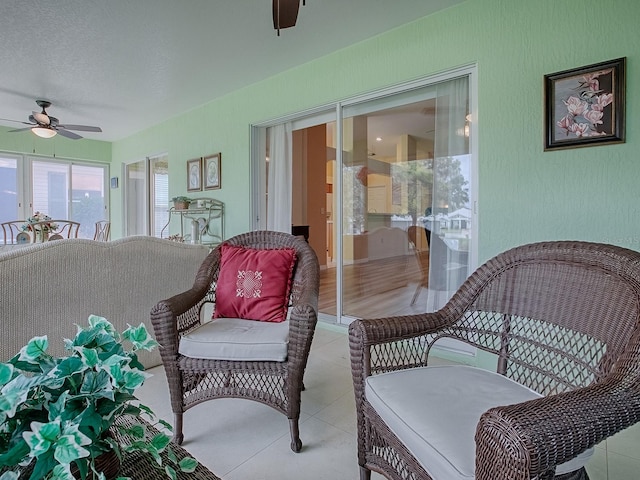 sunroom / solarium with ceiling fan