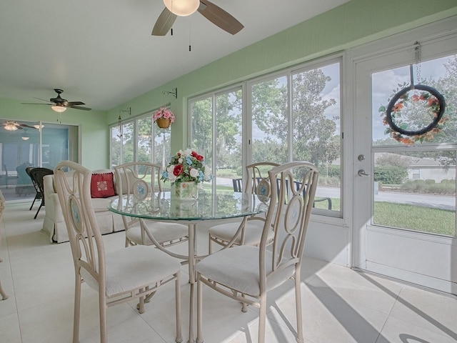 sunroom / solarium featuring a wealth of natural light and ceiling fan