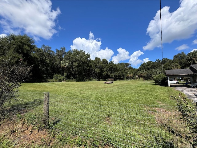 view of yard with a rural view