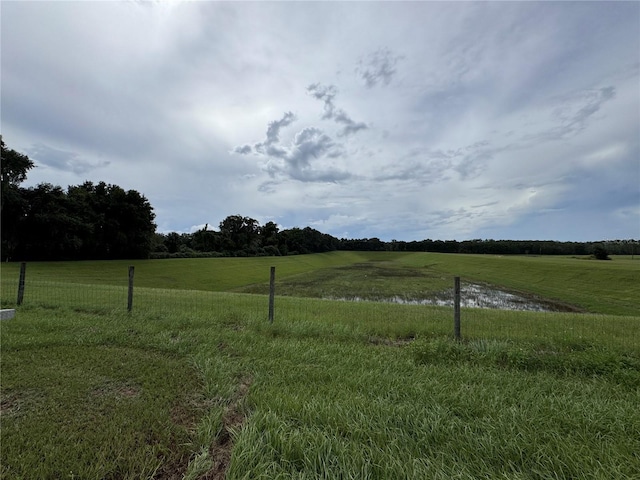 view of yard with a rural view