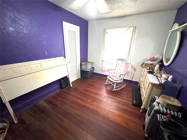 bedroom featuring ceiling fan and dark hardwood / wood-style floors