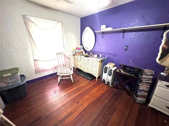 bedroom with dark hardwood / wood-style floors