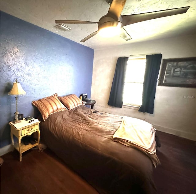 bedroom featuring wood-type flooring and ceiling fan