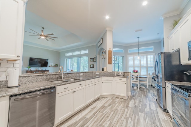 kitchen with white cabinetry, sink, ceiling fan, and stainless steel appliances