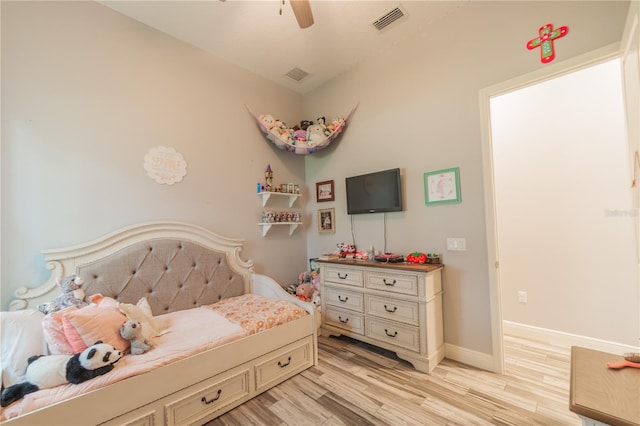 bedroom featuring light hardwood / wood-style flooring and ceiling fan