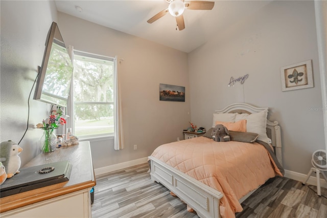 bedroom featuring light wood-type flooring and ceiling fan