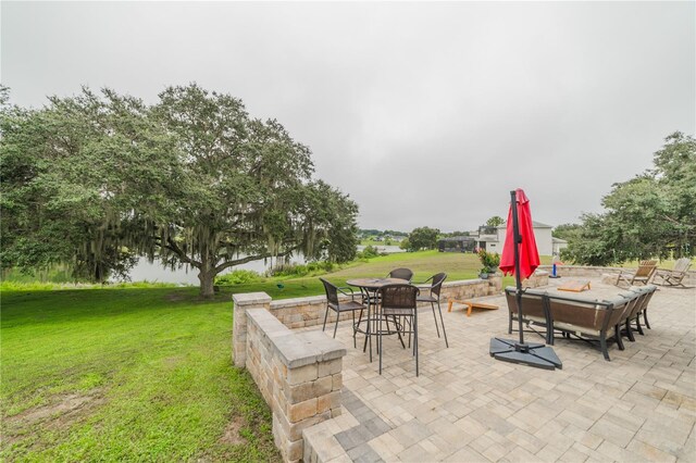 view of patio with a water view