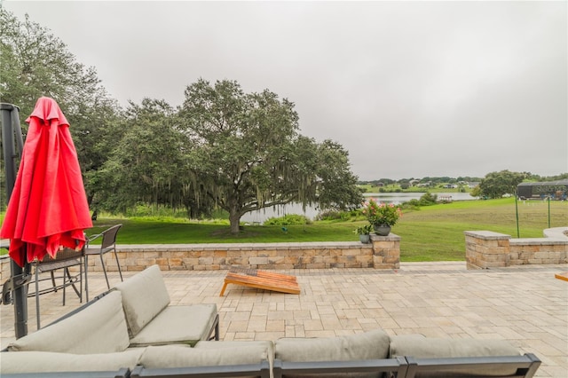 view of patio featuring a water view