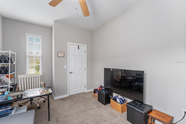 carpeted office with ceiling fan