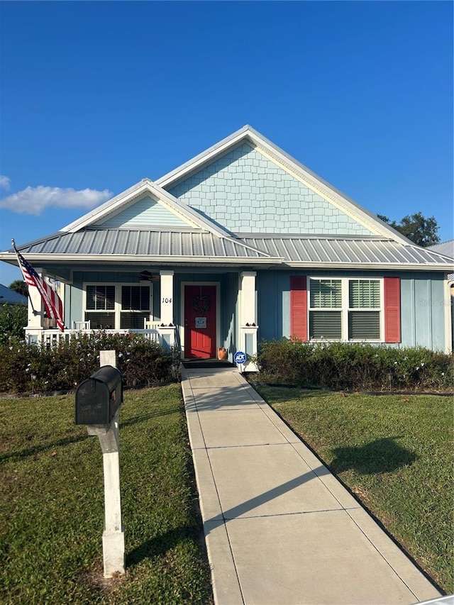 view of front of house with a front lawn and covered porch