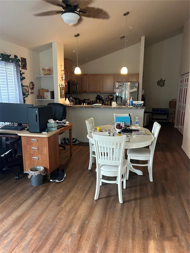 104 Turtle Run, Umatilla, FL 32784 - dining room featuring wood finished floors, a ceiling fan, lofted ceiling, and a desk