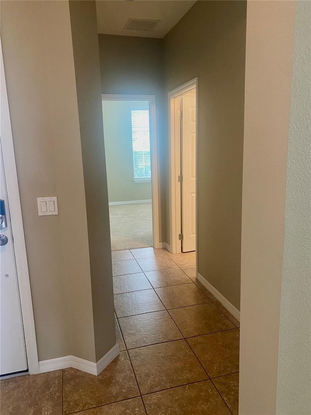 corridor with tile patterned floors