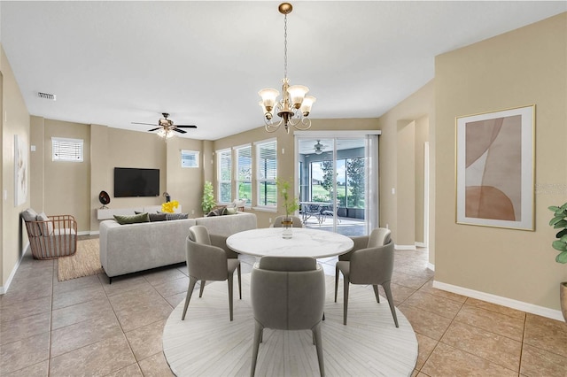 dining area featuring ceiling fan with notable chandelier and light tile patterned floors