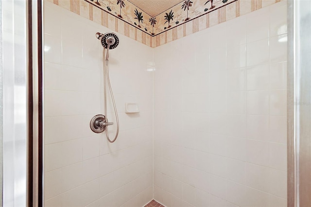 bathroom with a tile shower