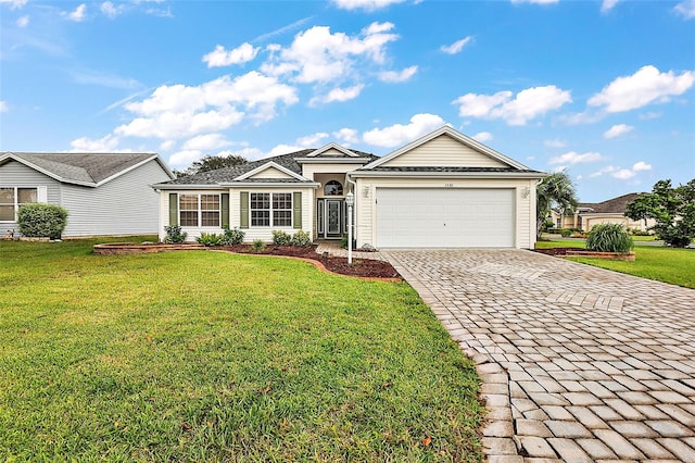 ranch-style house featuring a front yard and a garage