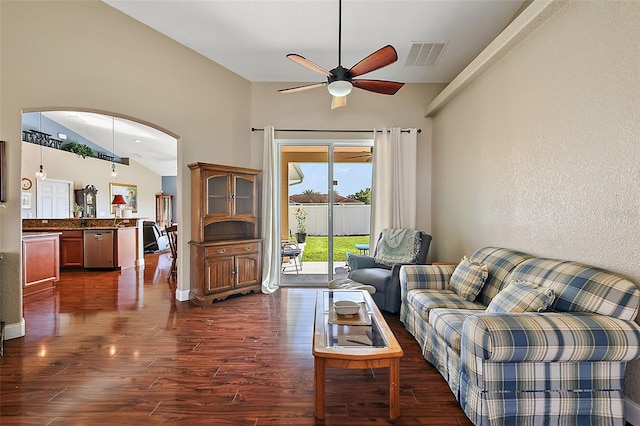 living room featuring ceiling fan, lofted ceiling, and dark hardwood / wood-style flooring