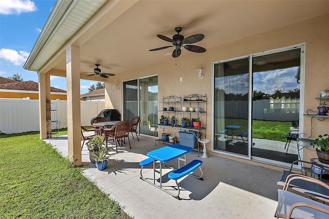 view of patio featuring ceiling fan