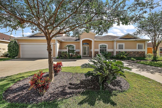 view of front facade featuring a front yard and a garage