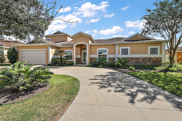 view of front facade with a front lawn and a garage