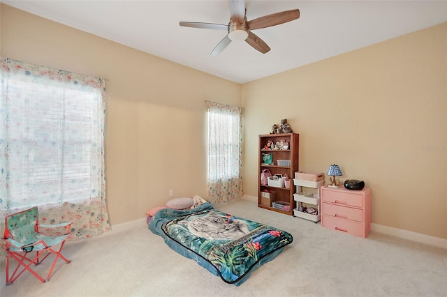 carpeted bedroom with ceiling fan