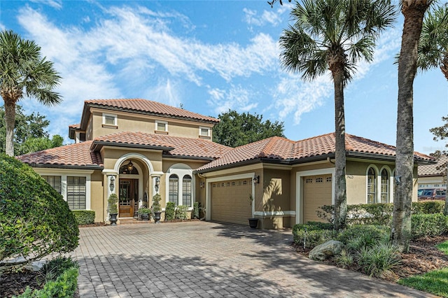 mediterranean / spanish-style home featuring a garage