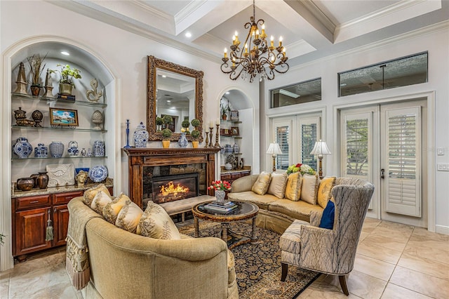 living room with a high end fireplace, beam ceiling, coffered ceiling, an inviting chandelier, and crown molding