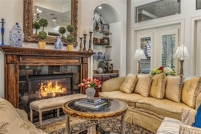 interior space with a premium fireplace and ornamental molding