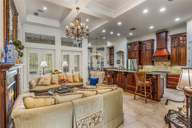 tiled living room with coffered ceiling, beam ceiling, an inviting chandelier, ornamental molding, and sink