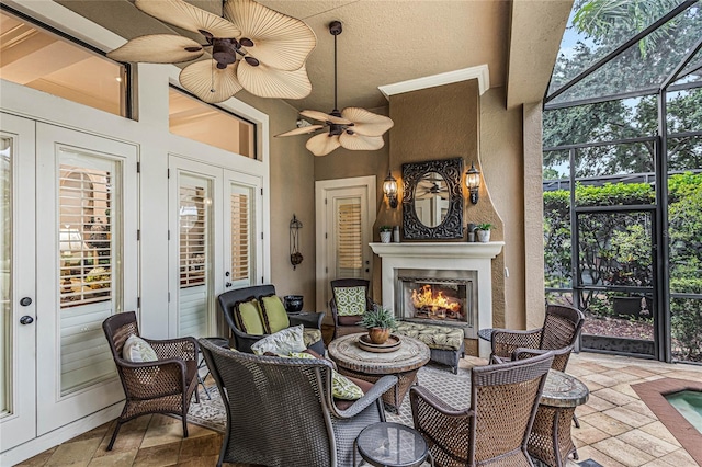 sunroom featuring ceiling fan