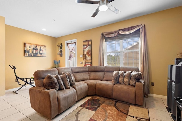 tiled living room with ceiling fan