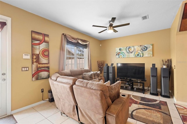 tiled living room with ceiling fan