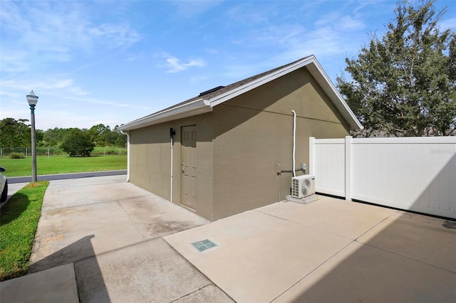 view of home's exterior featuring ac unit, a yard, and a patio