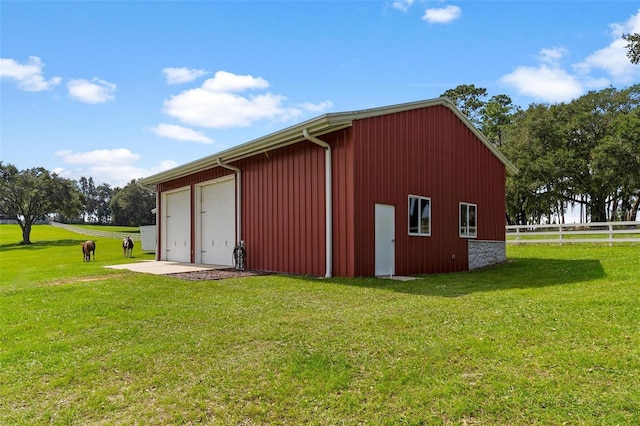 view of outdoor structure featuring a yard