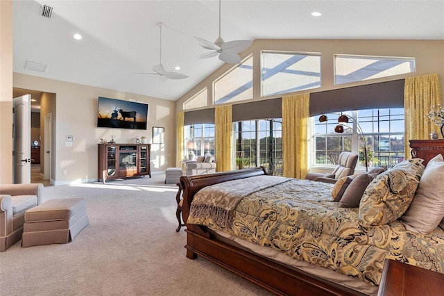 bedroom with ceiling fan, high vaulted ceiling, and carpet floors