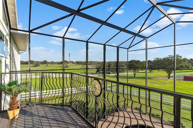 view of patio featuring a lanai and a balcony