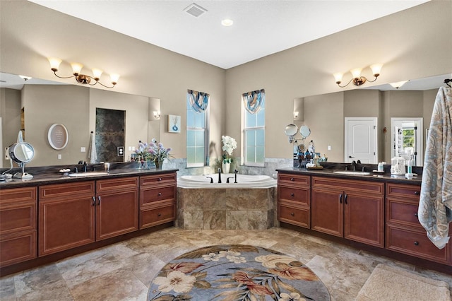 bathroom featuring vanity and separate shower and tub