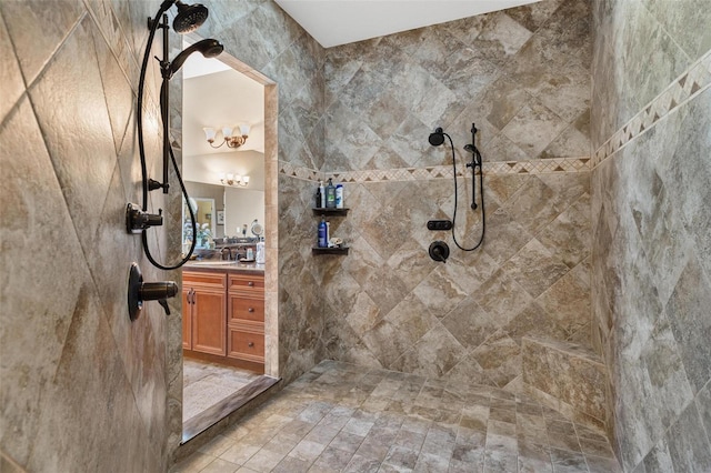 bathroom featuring vanity and a tile shower