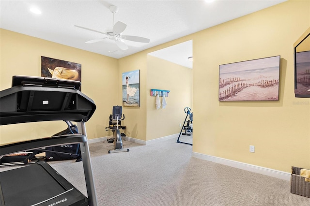 workout area with light colored carpet and ceiling fan