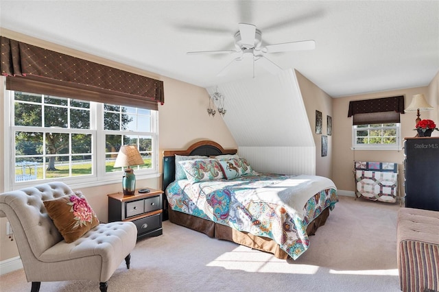 carpeted bedroom featuring lofted ceiling and ceiling fan