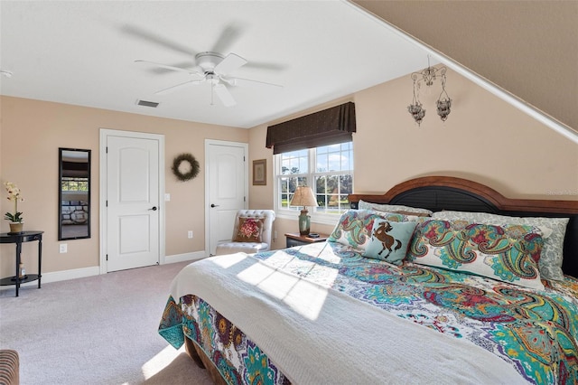 bedroom featuring ceiling fan and light carpet