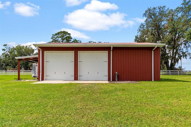 garage with a yard