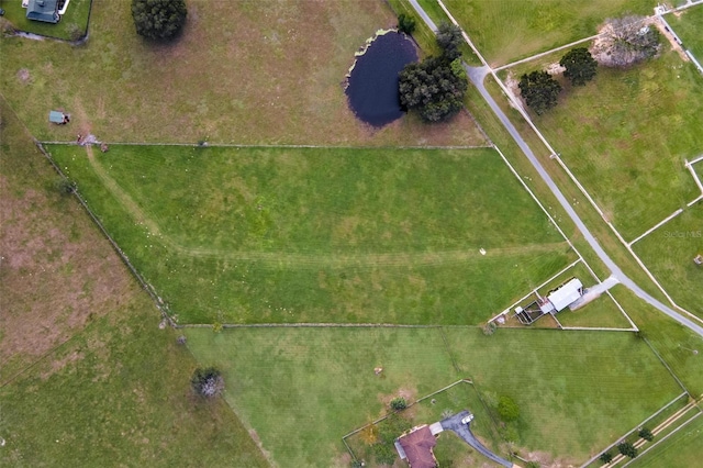 birds eye view of property featuring a rural view