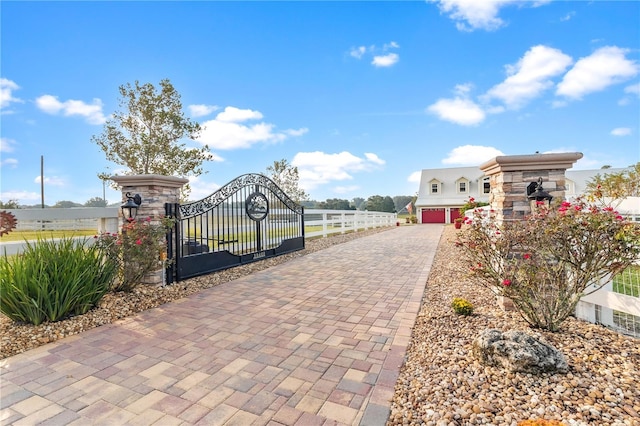 view of gate featuring a garage