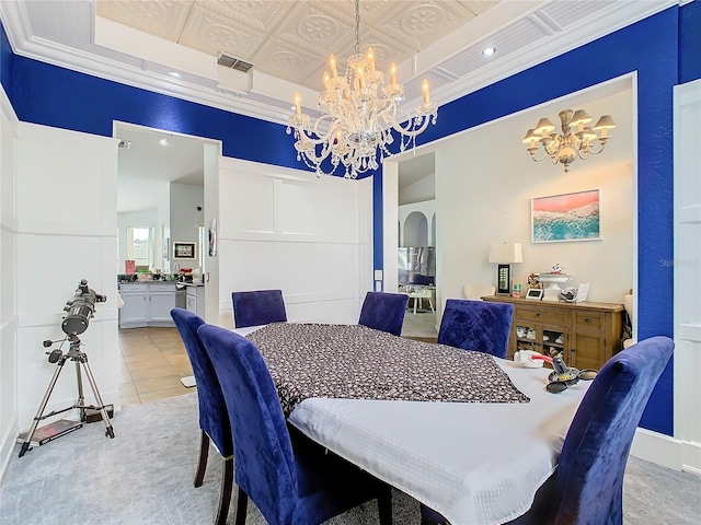 dining area featuring crown molding, a raised ceiling, light tile patterned floors, and a notable chandelier