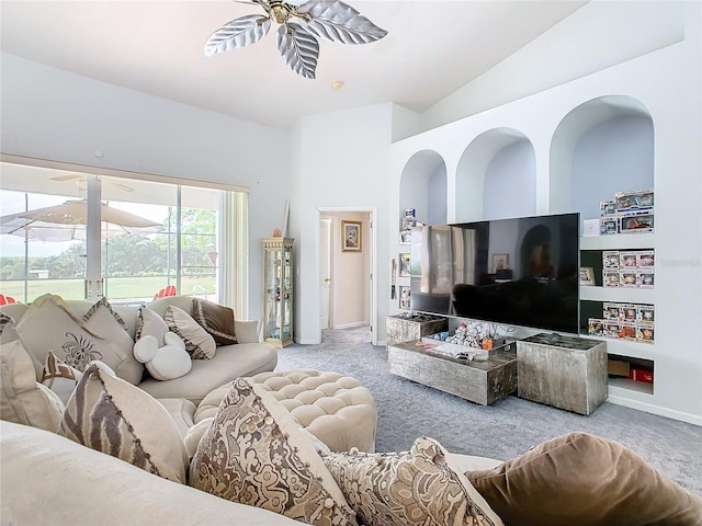 living room featuring light carpet, vaulted ceiling, and ceiling fan